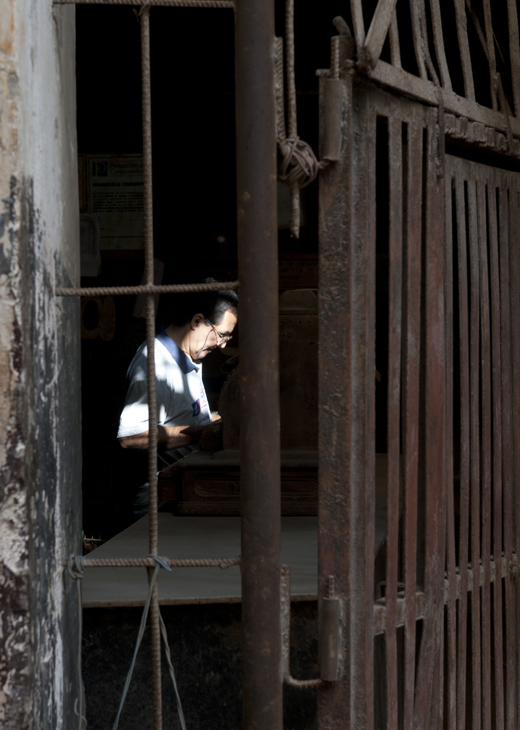 2011-12-01 - Havana Day - Worker Through Wrought Iron Doorway